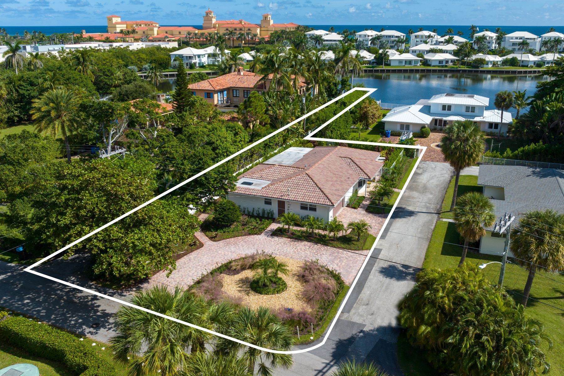Single Family Homes for Sale at Remodeled Hypoluxo Island Home with 48' Boat Dock 414 Beach Curve Road Lantana, Florida 33462 United States